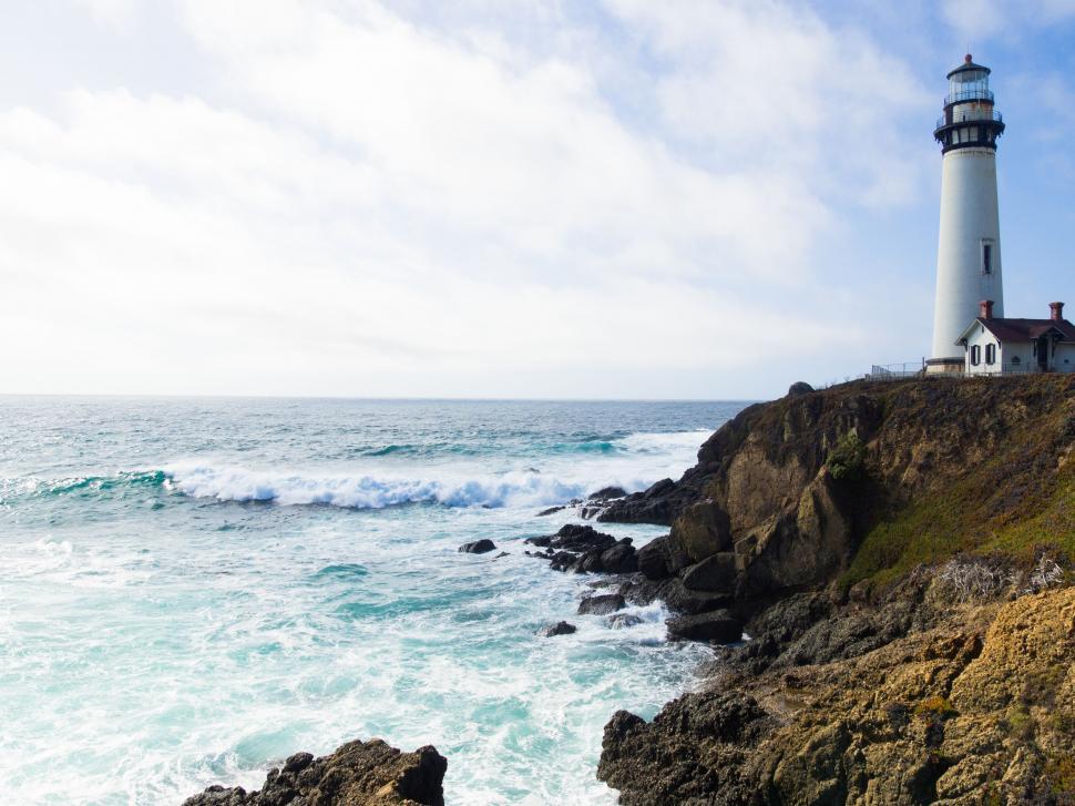 https://freerangestock.com/photos/162867/majestic-lighthouse-overlooking-the-ocean-waves.html